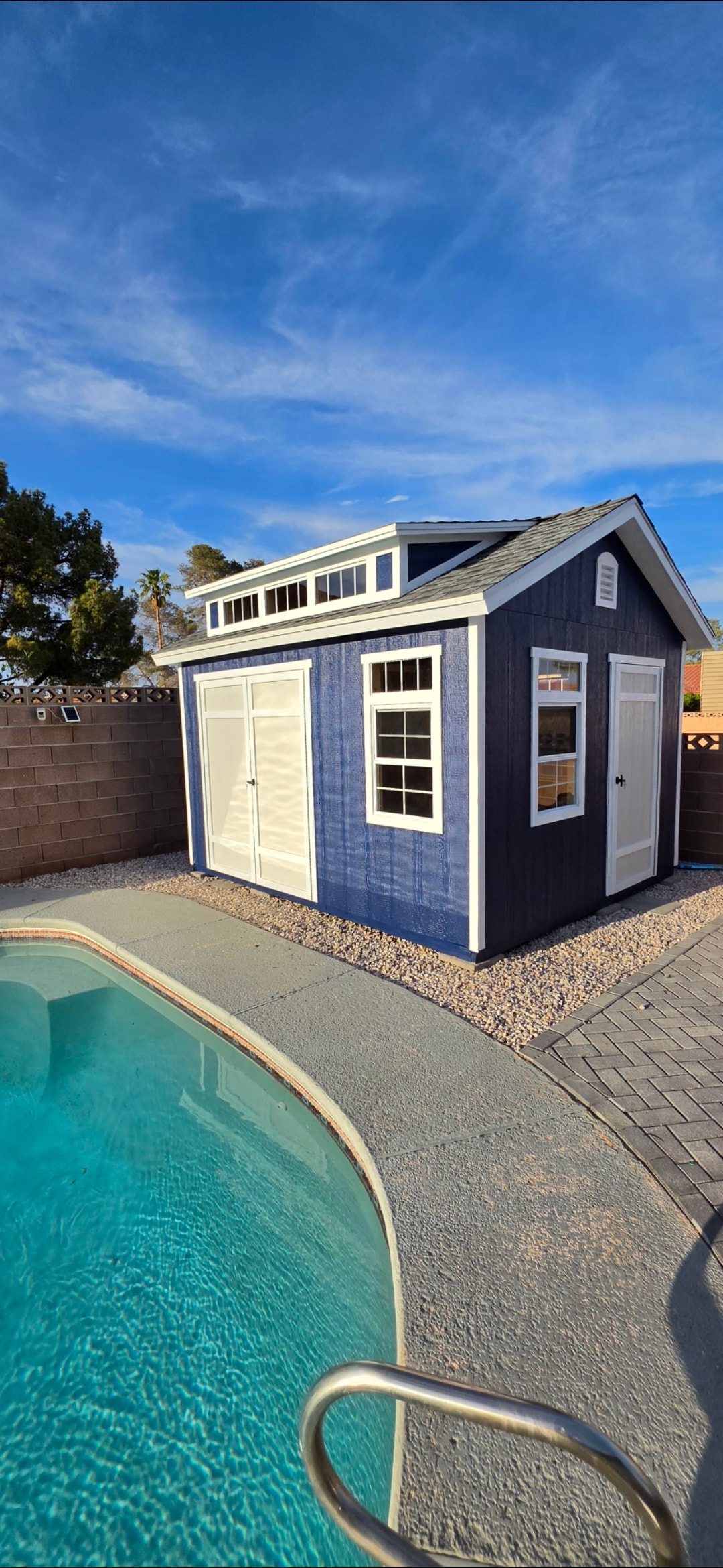 Backyard shed construction by pool